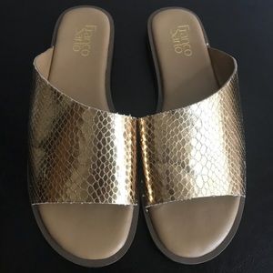 Gold Franco Sarto slip sandals.